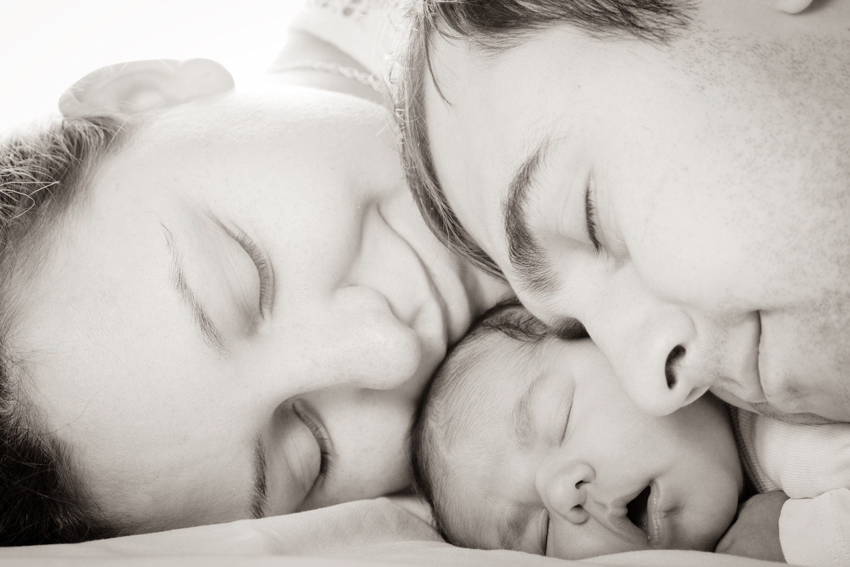 Baby with mom and dad Tampa Bay Infertility Experts